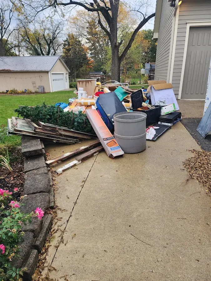 Dumpster being loaded with debris for 30 Yard Dumpster Rental in Homosassa Springs